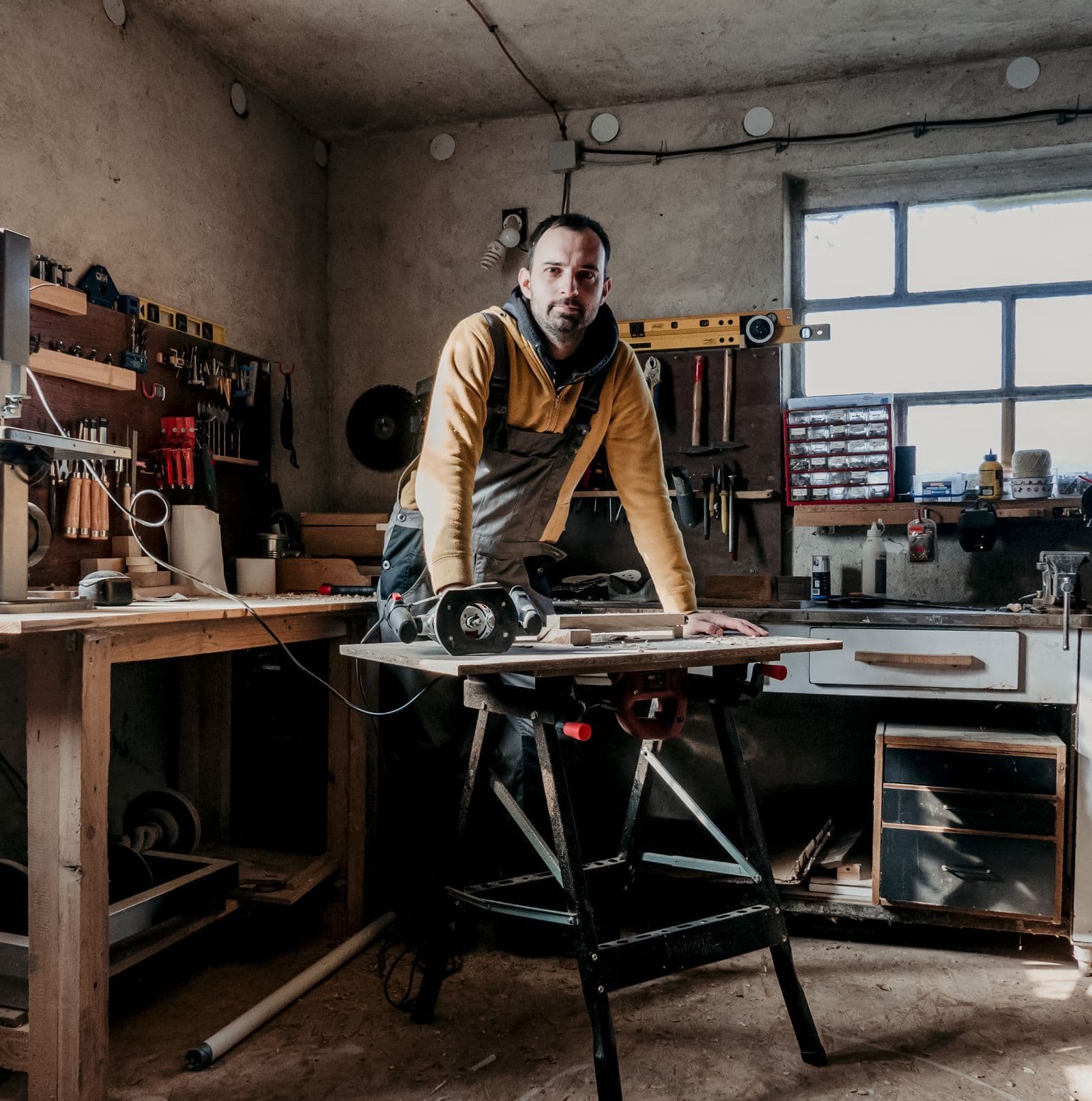 A Sacramento trades owner at ease in his shop, with the calls handled